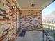 Inviting covered front porch showcasing the brick exterior and iron railing detail at 4401 Coachwood Ln, Gastonia, NC 28056
