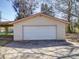 Detached garage with a white facade and double door at 4401 Coachwood Ln, Gastonia, NC 28056