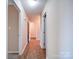 Hallway with wood flooring offering seamless flow between rooms at 4401 Coachwood Ln, Gastonia, NC 28056