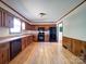 Well-lit kitchen features wood cabinets, modern appliances, and wood flooring for a warm, inviting space at 4401 Coachwood Ln, Gastonia, NC 28056