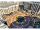 Aerial view of a community square with fountain, shops, and restaurants for residents at 4620 Piedmont Row Dr # 605, Charlotte, NC 28210