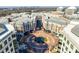 High-angle of the building complex and a vibrant courtyard with central fountain at 4620 Piedmont Row Dr # 605, Charlotte, NC 28210