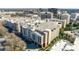 Aerial view of building showcasing complex architecture and roof top parking deck at 4620 Piedmont Row Dr # 605, Charlotte, NC 28210