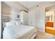 Comfortable bedroom featuring a full bed and decoratively painted canvas on wall at 4620 Piedmont Row Dr # 605, Charlotte, NC 28210