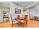 Dining room features an oval table with hardwood floors and gray walls at 4620 Piedmont Row Dr # 605, Charlotte, NC 28210