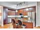 Kitchen view with stainless steel appliances, a granite counter and wood cabinets at 4620 Piedmont Row Dr # 605, Charlotte, NC 28210