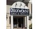 Inviting restaurant entrance with a prominent sign and traditional design elements at 4620 Piedmont Row Dr # 605, Charlotte, NC 28210