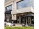 Elegant restaurant entrance with outdoor seating and modern architectural details at 4620 Piedmont Row Dr # 605, Charlotte, NC 28210