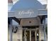 Close up view of Bentley's Restaurant entrance, sign, and outdoor lighting at 4620 Piedmont Row Dr # 605, Charlotte, NC 28210
