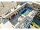 A high angle of a rooftop pool area and sundeck for residents of the luxury condo building at 4620 Piedmont Row Dr, Charlotte, NC 28210