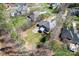 Aerial view of home featuring a large backyard, patio, deck, and mature trees at 4858 Sagittarius Cir, Denver, NC 28037