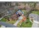 Aerial view of home, showcasing the front yard, driveway, and mature landscaping at 4858 Sagittarius Cir, Denver, NC 28037