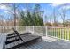 Relax on the back deck with lounge chairs while enjoying the peaceful surroundings at 4858 Sagittarius Cir, Denver, NC 28037