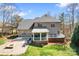 Spacious home backyard with lush lawn, stone patio and outdoor dining area, perfect for gathering at 4858 Sagittarius Cir, Denver, NC 28037