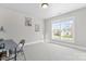 Neutral-toned bedroom with bright natural light, perfect for relaxing or working at 4858 Sagittarius Cir, Denver, NC 28037