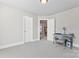Spacious bedroom featuring neutral tones, desk, and an abundance of natural light at 4858 Sagittarius Cir, Denver, NC 28037