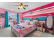 Vibrant bedroom featuring bright pink walls, decorative lighting, and workstation at 4858 Sagittarius Cir, Denver, NC 28037