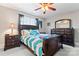 This spacious bedroom is well lit and decorated with blue accents and dark furniture at 4858 Sagittarius Cir, Denver, NC 28037