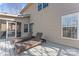 This outdoor deck features two lounge chairs and looks onto the home's exterior and a screened in porch at 4858 Sagittarius Cir, Denver, NC 28037