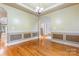 Formal dining room with hardwood floors, chandelier, and wainscoting, perfect for elegant gatherings at 4858 Sagittarius Cir, Denver, NC 28037