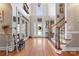 Grand foyer featuring hardwood floors, staircase, and a front door with decorative glass, creating a welcoming entrance at 4858 Sagittarius Cir, Denver, NC 28037