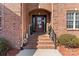 Charming front porch features decorative accents, an arched brickway, and an inviting entrance at 4858 Sagittarius Cir, Denver, NC 28037