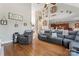 Large living room with hardwood floors, vaulted ceilings and open views to the kitchen and staircase at 4858 Sagittarius Cir, Denver, NC 28037