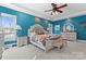 A beautifully decorated main bedroom features a decorative ceiling fan and a sitting bench at the foot of the bed at 4858 Sagittarius Cir, Denver, NC 28037
