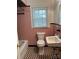 Pink tiled bathroom with black and white checkered floors and vintage fixtures at 501 Franklin Ave, Shelby, NC 28150