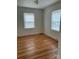 Bedroom with hardwood floors, two windows and neutral walls at 501 Franklin Ave, Shelby, NC 28150