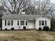 Charming single-story home with white siding, black shutters, and a well-maintained front yard at 501 Franklin Ave, Shelby, NC 28150