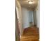 Hallway featuring hardwood floors and multiple doorways to various rooms in the home at 501 Franklin Ave, Shelby, NC 28150