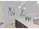 Powder room features marble countertops, a decorative mirror, and a vintage-inspired faucet at 5114 Morrowick Rd, Charlotte, NC 28226