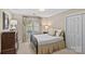Bedroom featuring neutral walls, large window with natural light and matching curtains, and dresser at 5114 Morrowick Rd, Charlotte, NC 28226