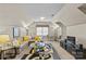 Cozy bonus room with a comfortable seating area, TV, and a table set for games or snacks at 5114 Morrowick Rd, Charlotte, NC 28226