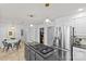 Bright kitchen with granite counters, stainless steel appliances, island cooktop, and breakfast nook at 5114 Morrowick Rd, Charlotte, NC 28226