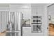 Modern kitchen features stainless steel appliances, white cabinets, and a built-in double oven at 5114 Morrowick Rd, Charlotte, NC 28226