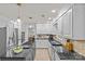 Spacious kitchen with granite counters, stainless steel appliances, island cooktop, and white cabinets at 5114 Morrowick Rd, Charlotte, NC 28226