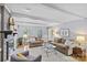 Spacious living room with neutral decor, fireplace, hardwood floors, and ample natural light at 5114 Morrowick Rd, Charlotte, NC 28226