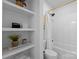 Bright white bathroom features open shelving, bathtub with subway tile and a modern showerhead at 680 Ideal Way, Charlotte, NC 28203