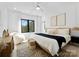 This main bedroom features a large bed, natural light, designer rug, and modern decor, creating a serene space at 680 Ideal Way, Charlotte, NC 28203