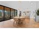 Sunlit dining area boasts hardwood floors, backyard views and modern lighting at 680 Ideal Way, Charlotte, NC 28203