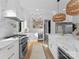 The kitchen offers a stylish island with seating, modern appliances and natural light at 680 Ideal Way, Charlotte, NC 28203