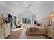 Bright main bedroom featuring a vaulted ceiling, neutral decor, modern furnishings, and a stylish egg chair at 680 Ideal Way, Charlotte, NC 28203