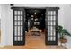 Stylish home office with dark walls, modern lighting, a wooden desk, and elegant sliding barn doors at 680 Ideal Way, Charlotte, NC 28203