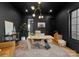 Contemporary home office with dark walls, a modern desk, stylish decor, and ample natural light at 680 Ideal Way, Charlotte, NC 28203