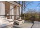 Outdoor patio with comfortable seating, a modern fire pit, black railings, and a view of the yard at 680 Ideal Way, Charlotte, NC 28203