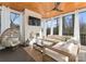 Covered porch features wood ceilings, a modern fireplace, and ample lounge seating for relaxation and outdoor entertainment at 680 Ideal Way, Charlotte, NC 28203
