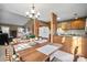 Open-concept dining area with a table set for a meal, adjacent to the kitchen and living areas at 7327 Carrbridge Ln, Charlotte, NC 28226