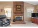 Close-up of a brick fireplace featuring a decorative mantel, cozy hearth, and classic design elements in a living room at 7327 Carrbridge Ln, Charlotte, NC 28226